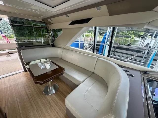 Slide: The Image of Luxurious interior of 2017 Regal 53 Sport Coupe yacht with elegant seating and table. - 34