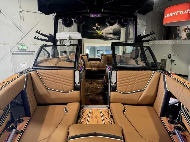 Slide: The Image of 2025 Tigé ULTRE 23ZX boat interior with luxurious tan seating and modern design. - 15