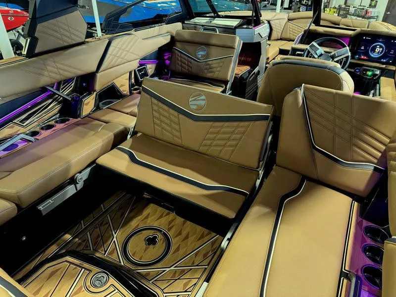 Slide: The Image of 2025 Tigé ULTRE 23ZX boat interior with luxurious tan seating and modern design. - 9