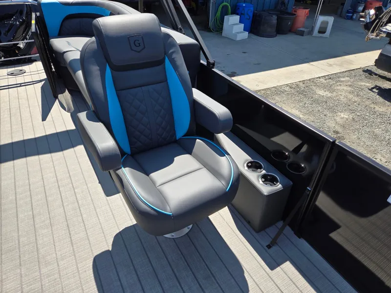 Slide: The Image of Luxurious seating on 2025 Godfrey Sweetwater 2486 SB boat with cup holders. - 14