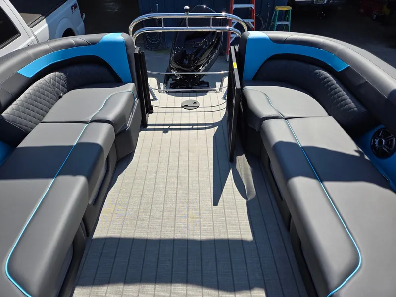 Slide: The Image of 2025 Godfrey Sweetwater 2486 SB pontoon boat interior with gray and blue seating. - 22