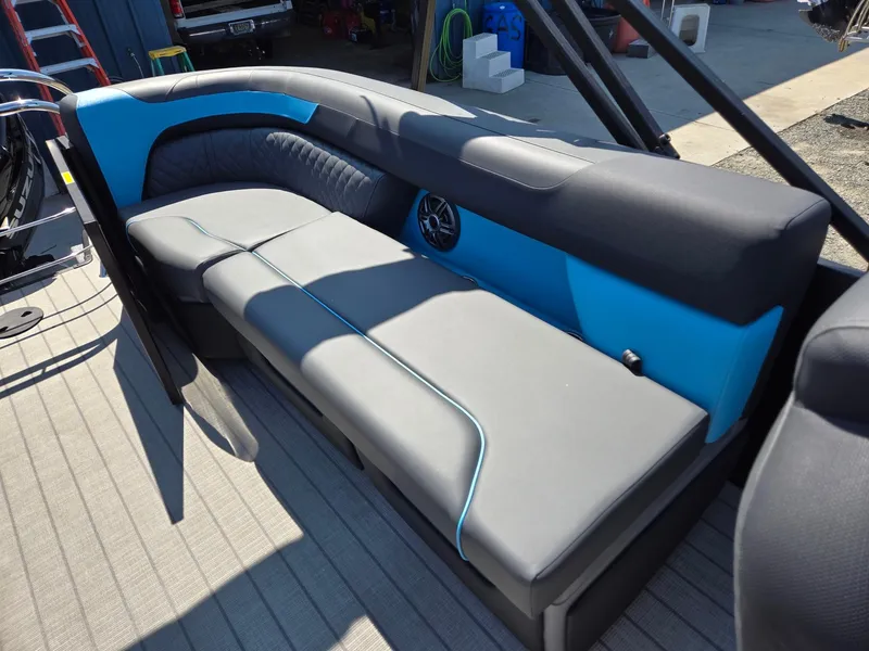 Slide: The Image of 2025 Godfrey Sweetwater 2486 SB boat seating with blue and gray upholstery. - 24
