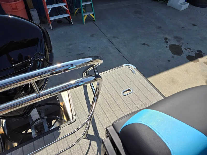 Slide: The Image of 2025 Godfrey Sweetwater 2486 SB boat deck with railing and seating detail. - 26