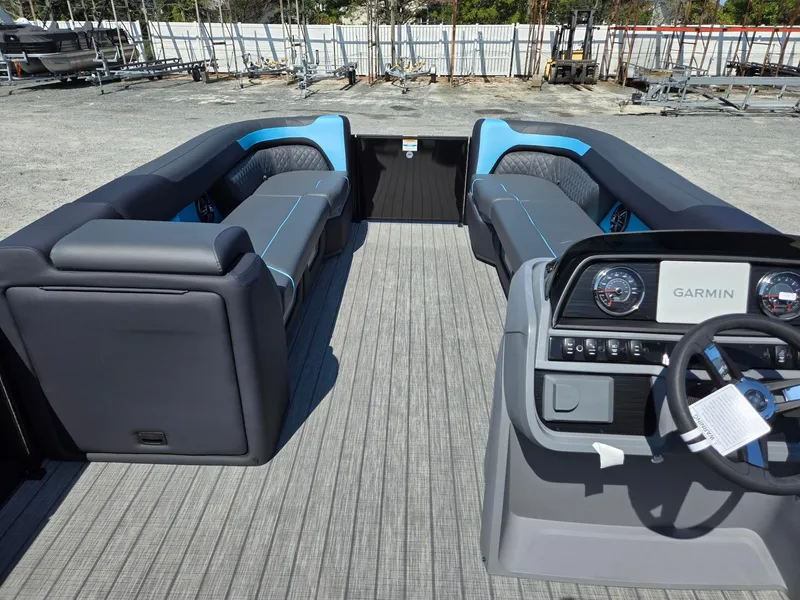 Slide: The Image of 2025 Godfrey Sweetwater 2486 SB pontoon boat interior with modern seating and Garmin dashboard. - 31