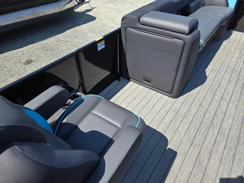Slide: The Image of 2025 Godfrey Sweetwater 2486 SB boat interior with modern seating and flooring. - 32