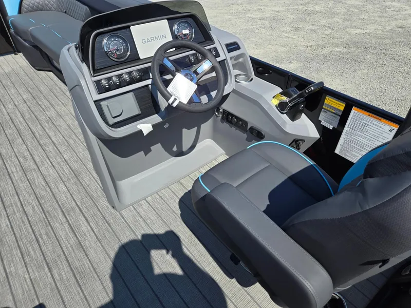 Slide: The Image of 2025 Godfrey Sweetwater 2486 SB boat dashboard with Garmin navigation system. - 33