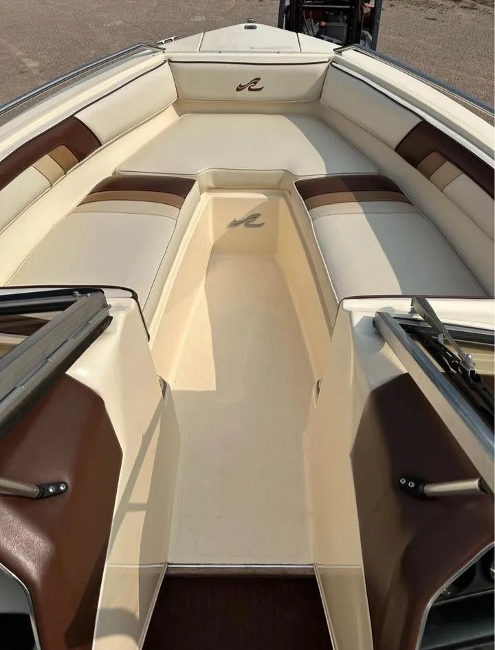 Slide: The Image of 1987 Sea Ray Sorrento 21 boat interior with beige and brown seating. - 4