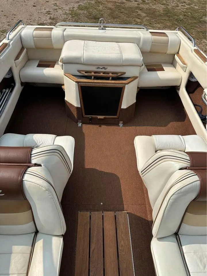 Slide: The Image of 1987 Sea Ray Sorrento 21 boat interior with beige and brown seating. - 8