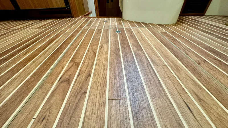 Slide: The Image of Wood flooring inside a 2012 Viking 42 Open boat. - 17