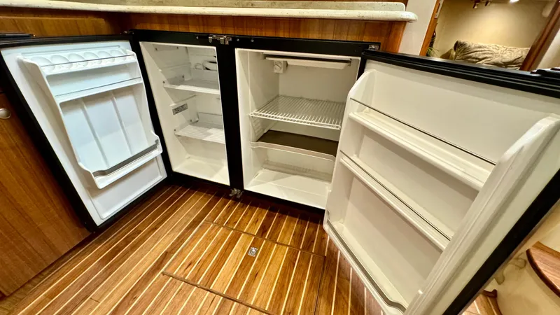 Slide: The Image of Open refrigerators on a 2012 Viking 42 Open boat. - 21