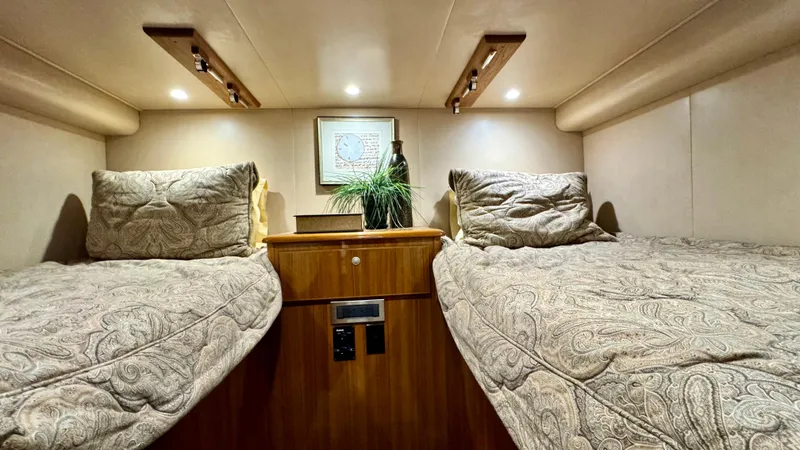 Slide: The Image of Interior of 2012 Viking 42 Open with twin beds. - 23