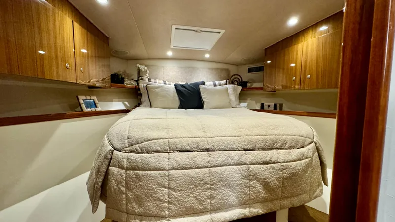 Slide: The Image of Interior of a 2012 Viking 42 Open yacht with cozy bedroom. - 25