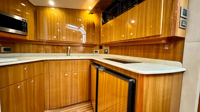 Slide: The Image of Interior of 2012 Viking 42 Open yacht with elegant wood finish. - 26