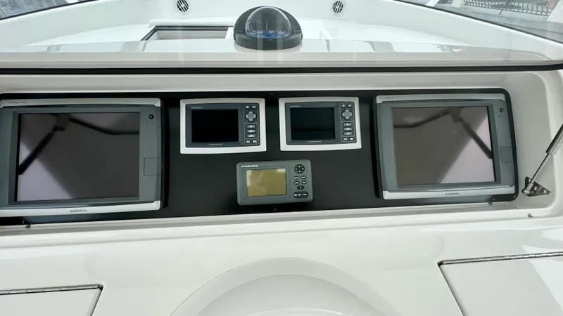 Slide: The Image of 2012 Viking 42 Open dashboard with navigation systems. - 31