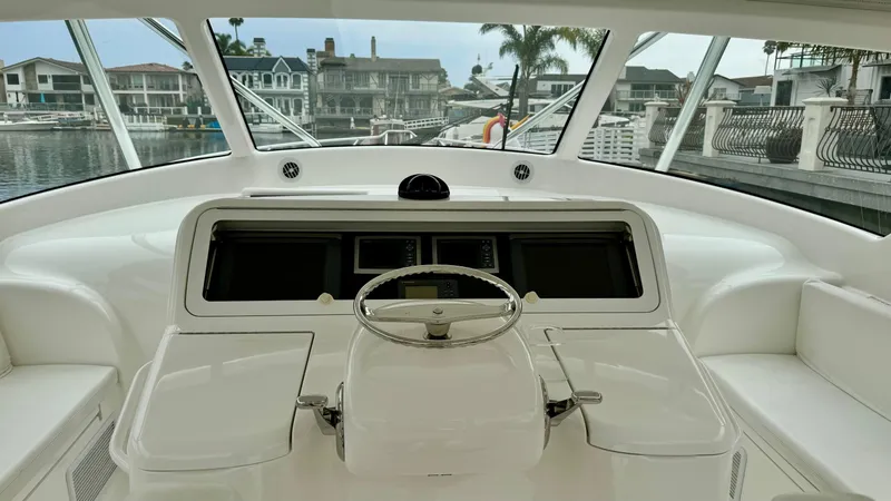Slide: The Image of Helm of 2012 Viking 42 Open yacht overlooking marina. - 33