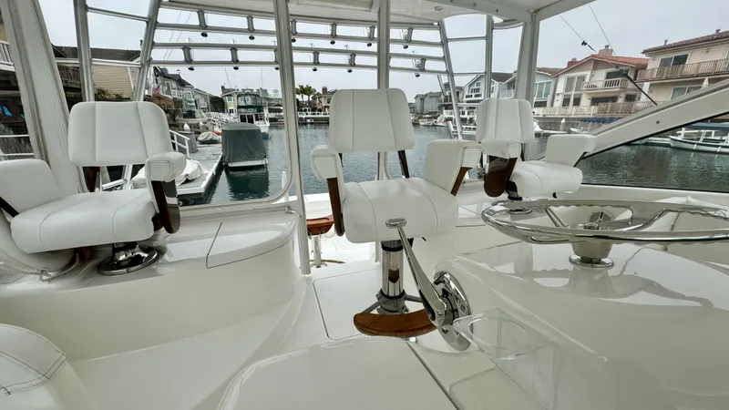 Slide: The Image of Interior of a 2012 Viking 42 Open yacht with white seating. - 40