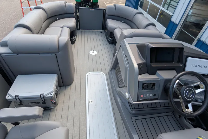 Slide: The Image of 2025 Avalon Catalina Versatile Rear Lounger interior with gray seating and modern dashboard. - 16