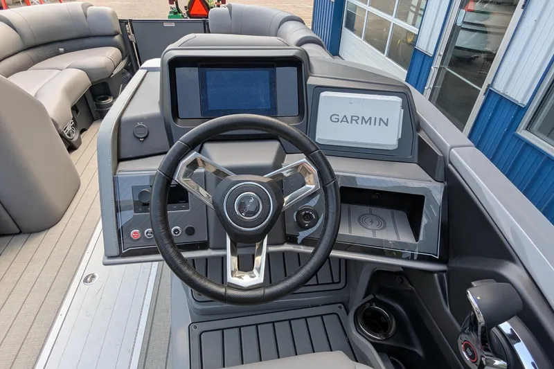 Slide: The Image of 2025 Avalon Catalina Versatile Rear Lounger dashboard with Garmin navigation system and steering wheel. - 17
