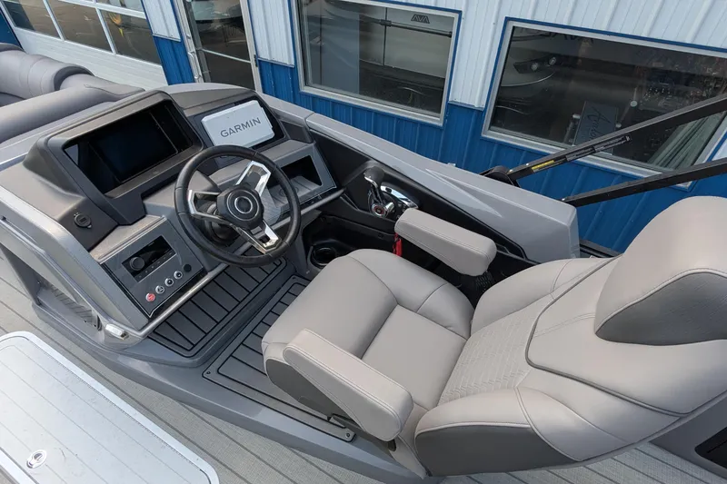 Slide: The Image of 2025 Avalon Catalina Versatile Rear Lounger boat cockpit with Garmin navigation system. - 21