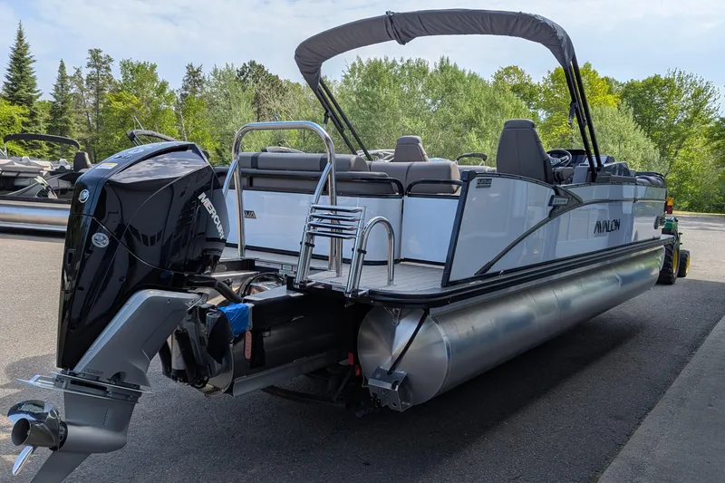Slide: The Image of 2025 Avalon Catalina Versatile Rear Lounger pontoon boat with Mercury outboard motor. - 3
