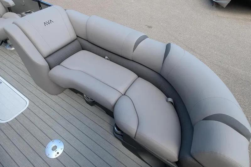 Slide: The Image of 2025 Avalon Catalina Versatile Rear Lounger with plush gray seating on a boat deck. - 9