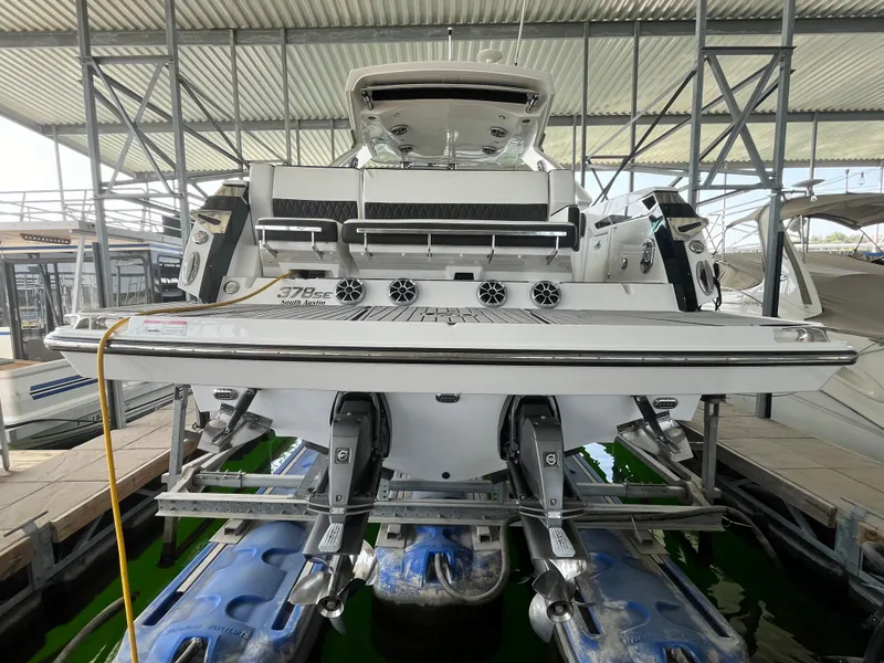 Slide: The Image of 2018 Monterey 378 SE boat docked in a covered marina. - 12