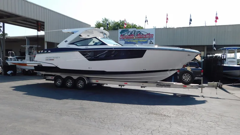 Slide: The Image of 2018 Monterey 378 SE boat on trailer at dealership, side view. - 13