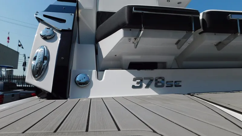 Slide: The Image of 2018 Monterey 378 SE boat deck with seating and model branding. - 22