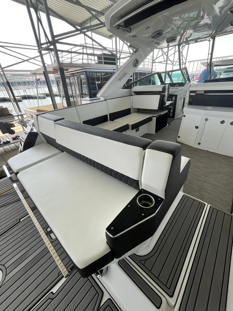 Slide: The Image of 2018 Monterey 378 SE boat interior with sleek seating and modern design. - 32