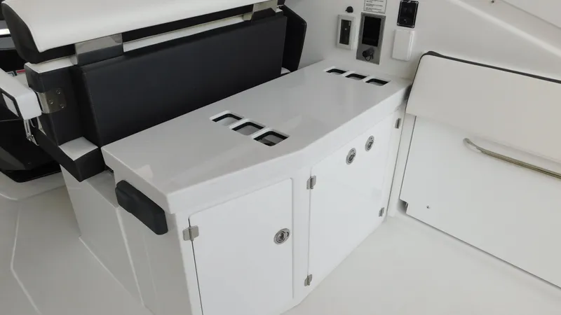 Slide: The Image of 2018 Monterey 378 SE boat interior with sleek white cabinetry and seating. - 35