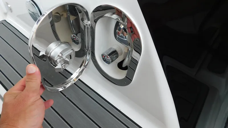 Slide: The Image of Hand opening fuel cap on 2018 Monterey 378 SE boat. - 41