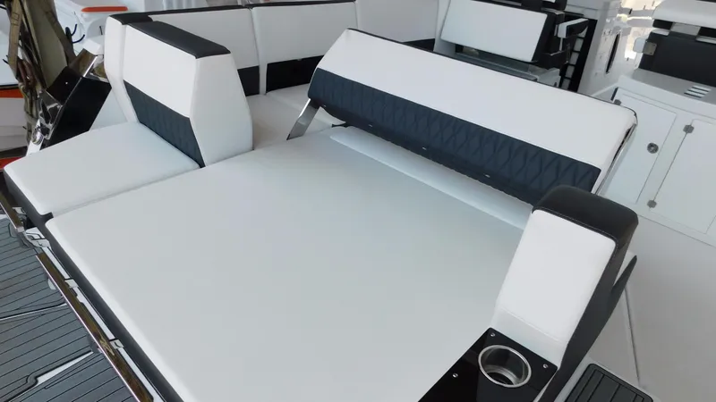Slide: The Image of 2018 Monterey 378 SE boat interior with white and black seating. - 43