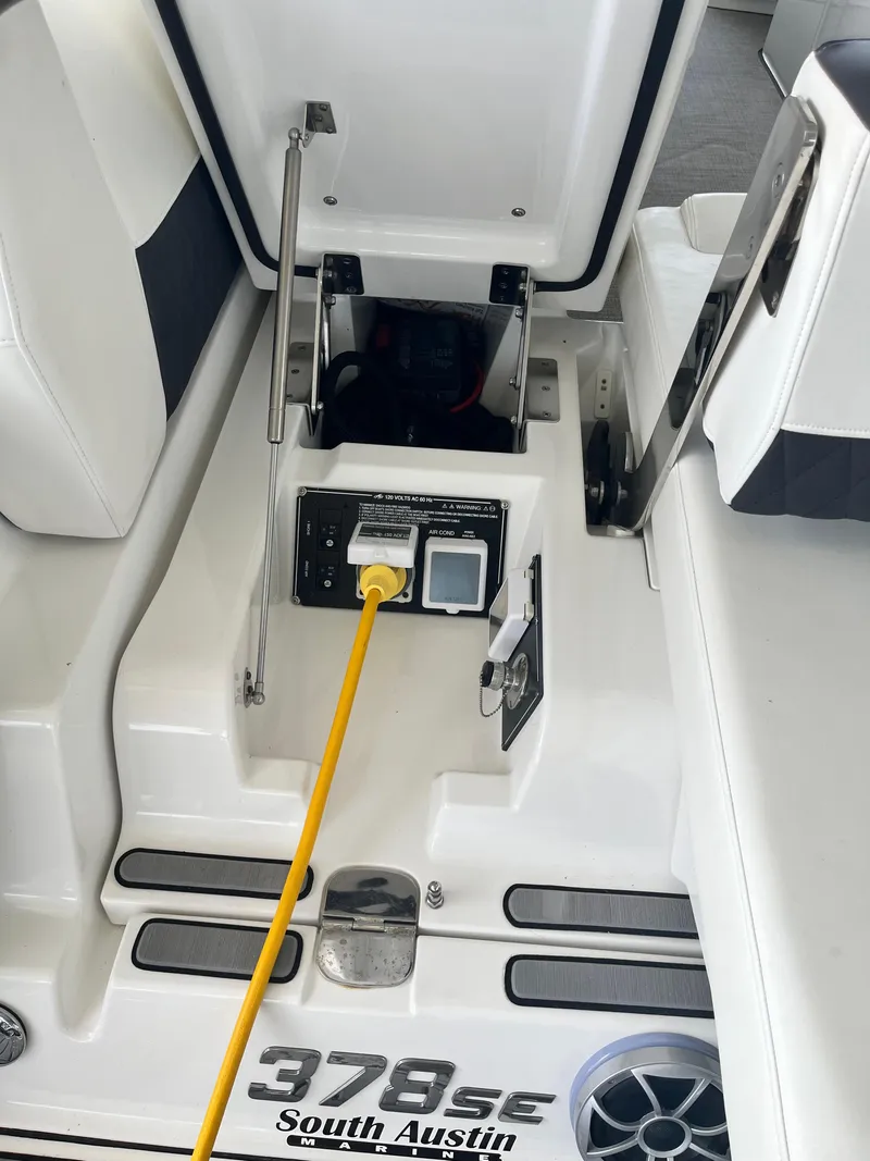 Slide: The Image of 2018 Monterey 378 SE boat interior with open hatch and power connection. - 47