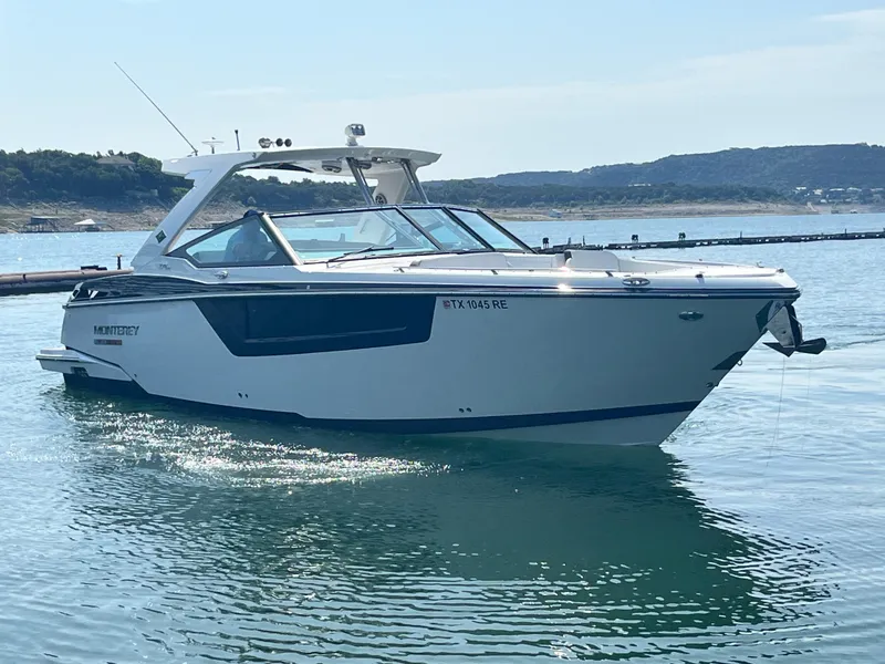 Slide: The Image of 2018 Monterey 378 SE boat on calm water with scenic background. - 8