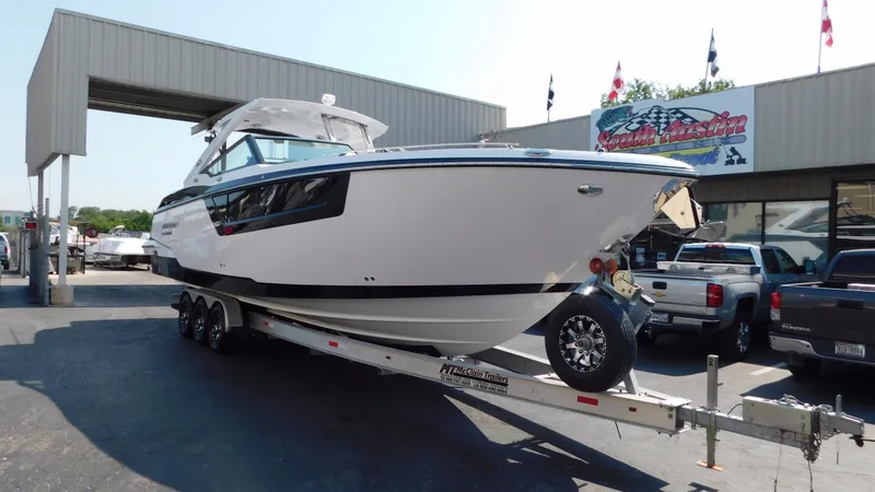 Slide: The Image of 2018 Monterey 378 SE boat on trailer at dealership. - 14