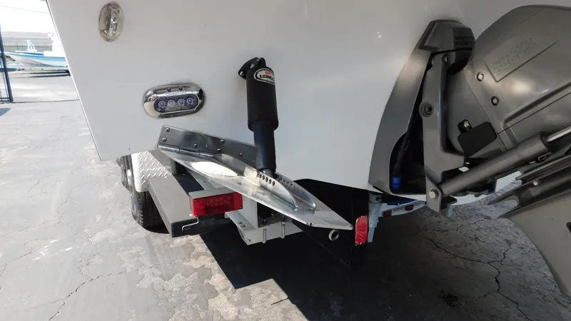 Slide: The Image of Rear view of 2018 Monterey 378 SE boat with motor and trim tabs. - 23