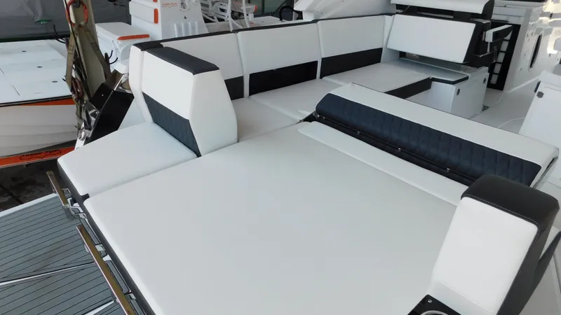 Slide: The Image of 2018 Monterey 378 SE boat interior with white and black seating. - 29