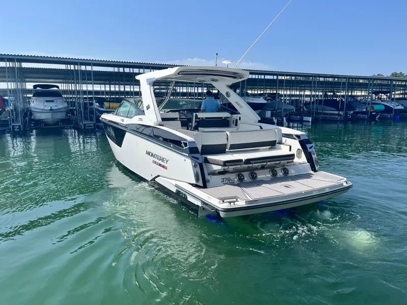 Slide: The Image of 2018 Monterey 378 SE boat docked in marina, rear view. - 3