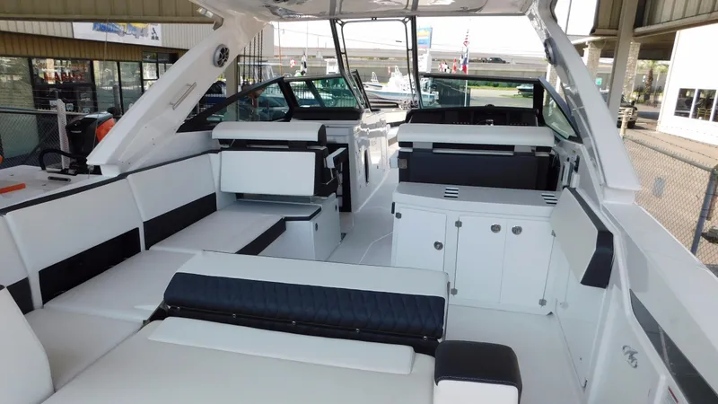 Slide: The Image of 2018 Monterey 378 SE boat interior with white seating and modern design. - 30