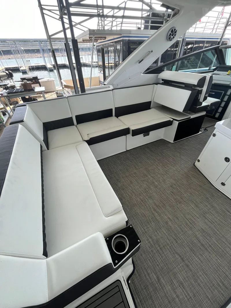 Slide: The Image of 2018 Monterey 378 SE boat interior with white and black seating. - 33