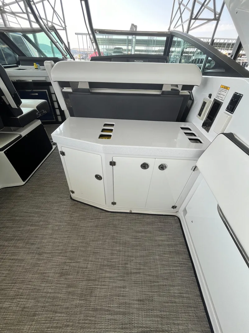 Slide: The Image of 2018 Monterey 378 SE boat interior with sleek white cabinetry and modern design. - 34