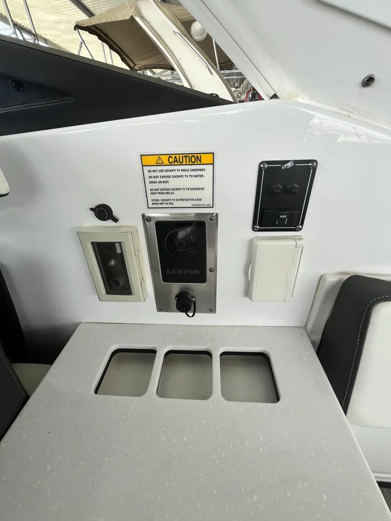 Slide: The Image of Control panel of 2018 Monterey 378 SE boat with caution sign and switches. - 36