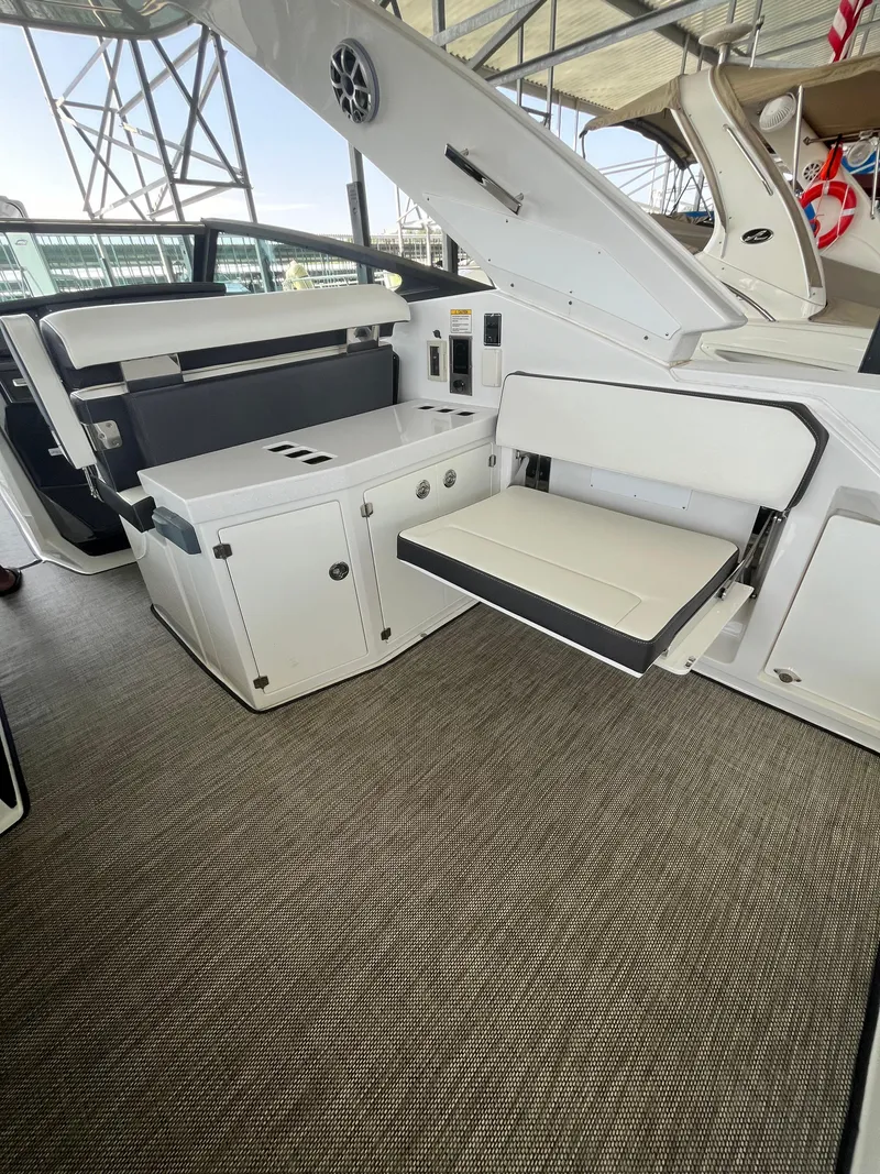 Slide: The Image of 2018 Monterey 378 SE boat interior with white seating and modern design. - 37