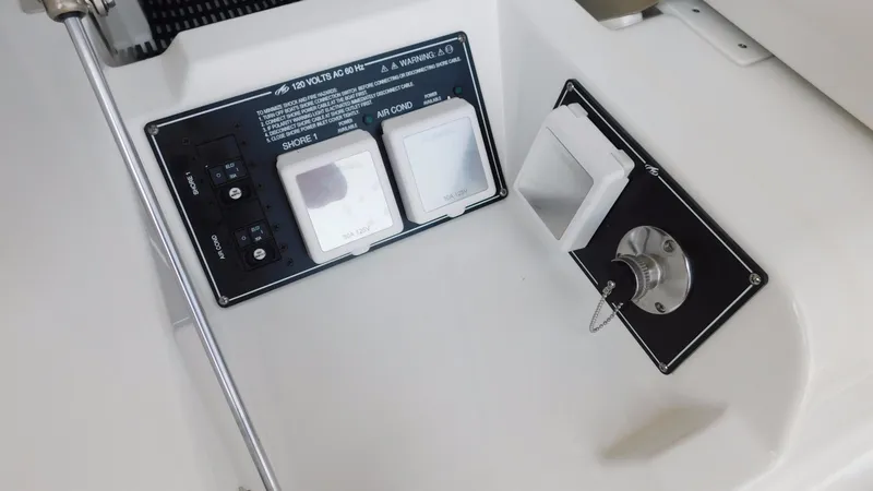 Slide: The Image of Control panel on a 2018 Monterey 378 SE boat, featuring switches and outlets. - 46