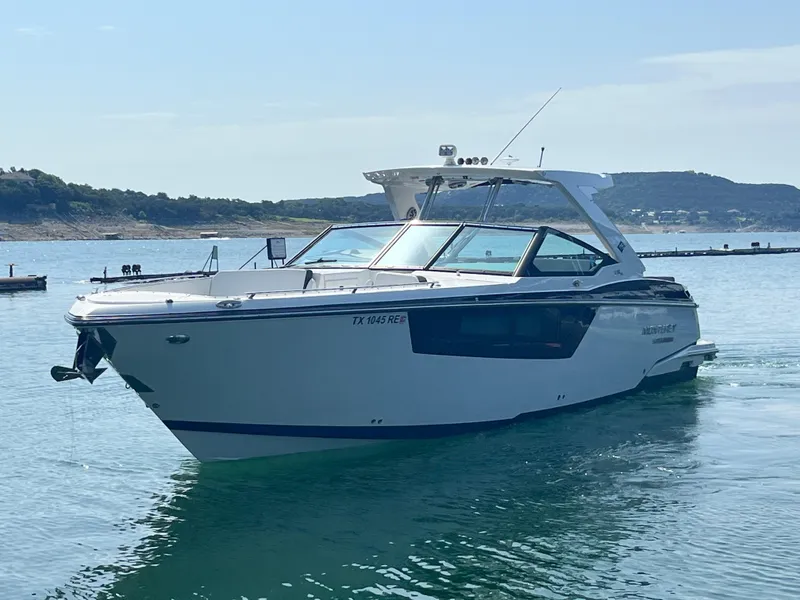 Slide: The Image of 2018 Monterey 378 SE boat cruising on a calm lake. - 5
