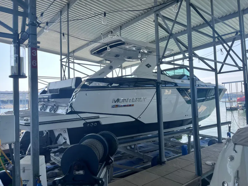 Slide: The Image of 2018 Monterey 378 SE boat docked in a covered marina. - 9
