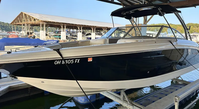 Slide: The Image of 2010 Cobalt 276 boat docked in marina, side view. - 1