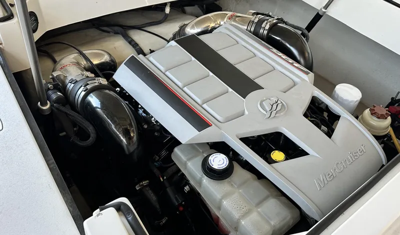 Slide: The Image of 2010 Cobalt 276 engine compartment with MerCruiser engine components. - 12