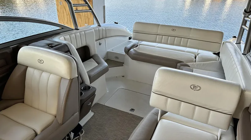 Slide: The Image of Interior of a 2010 Cobalt 276 boat with luxurious seating and water view. - 5