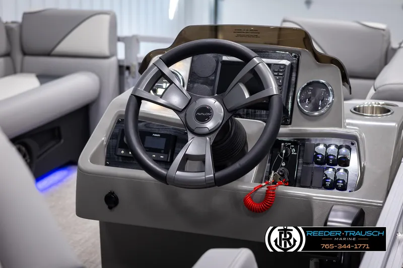 Slide: The Image of 2025 Avalon VEN QL boat dashboard with steering wheel and control panel. - 24